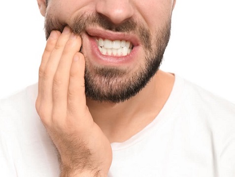 image of man in severe tooth pain