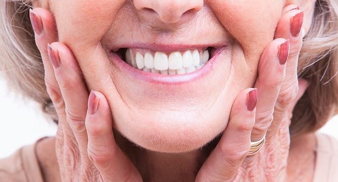 this is an image of happy older lady with dentures